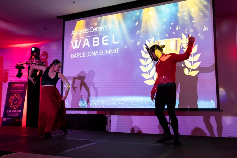 Dancers performing on stage at a business summit awards night